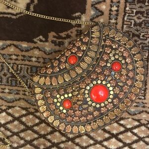 Elegant Gold and Red Embellished Clutch